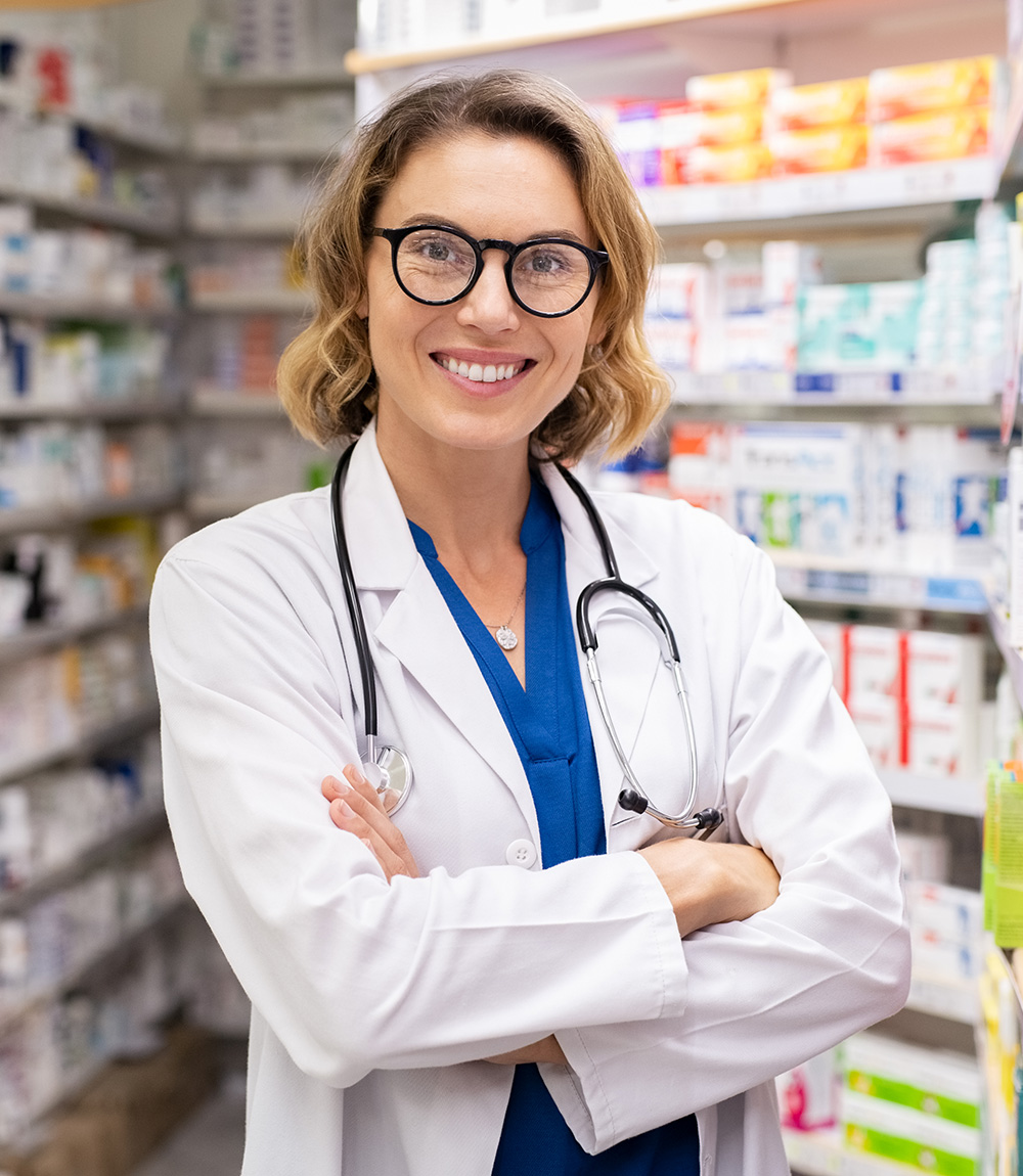 happy smiling pharmacist in drugstore C9R8PCC About Us