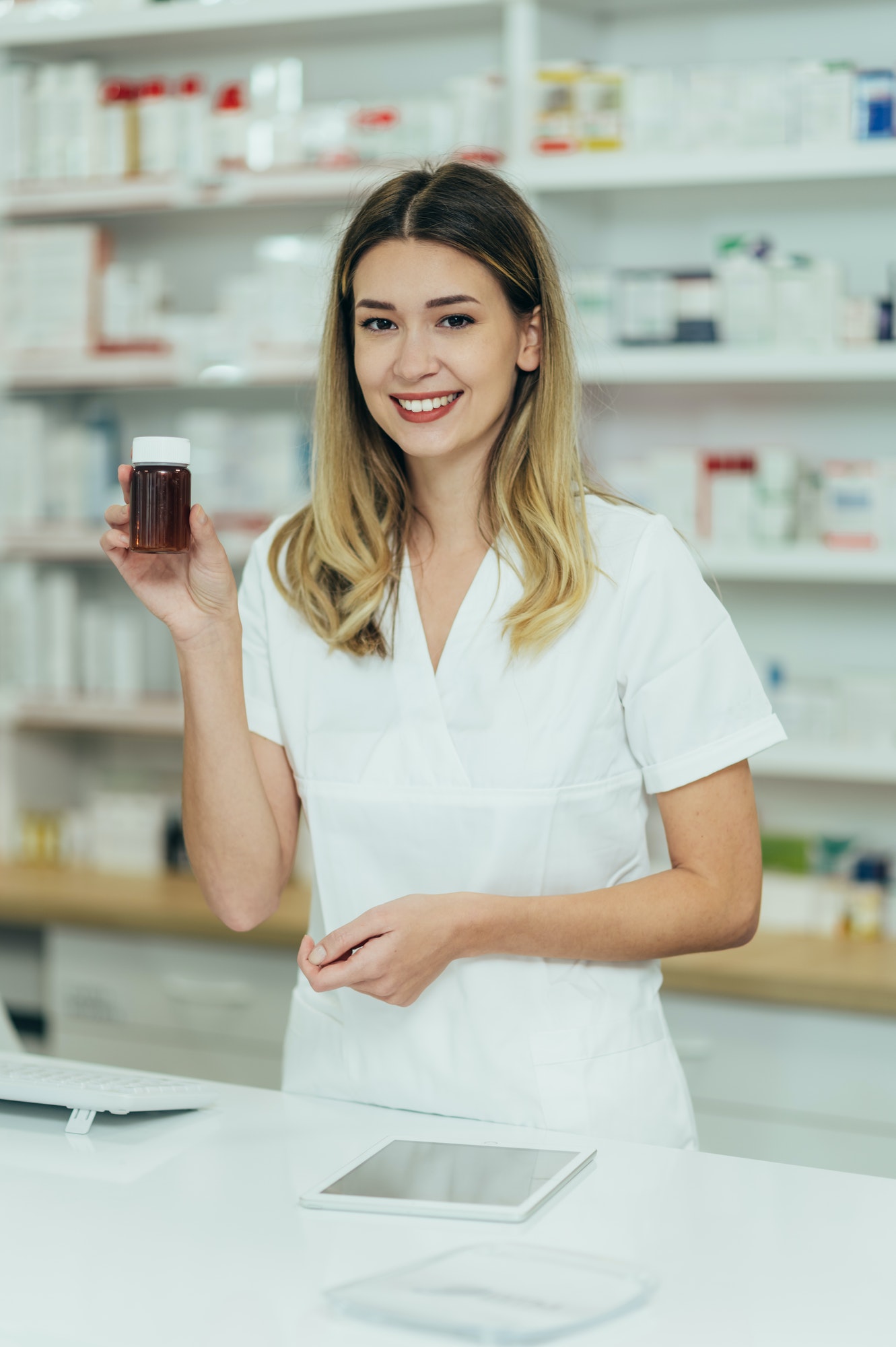 portrait of a beautiful female pharmacist working in a pharmacy 1 Home
